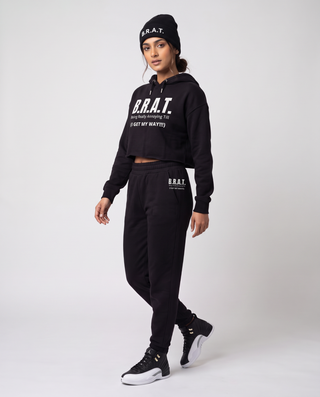 Model wearing the B.R.A.T. Cropped Hoodie, Black Joggers and Cuffed Beanie